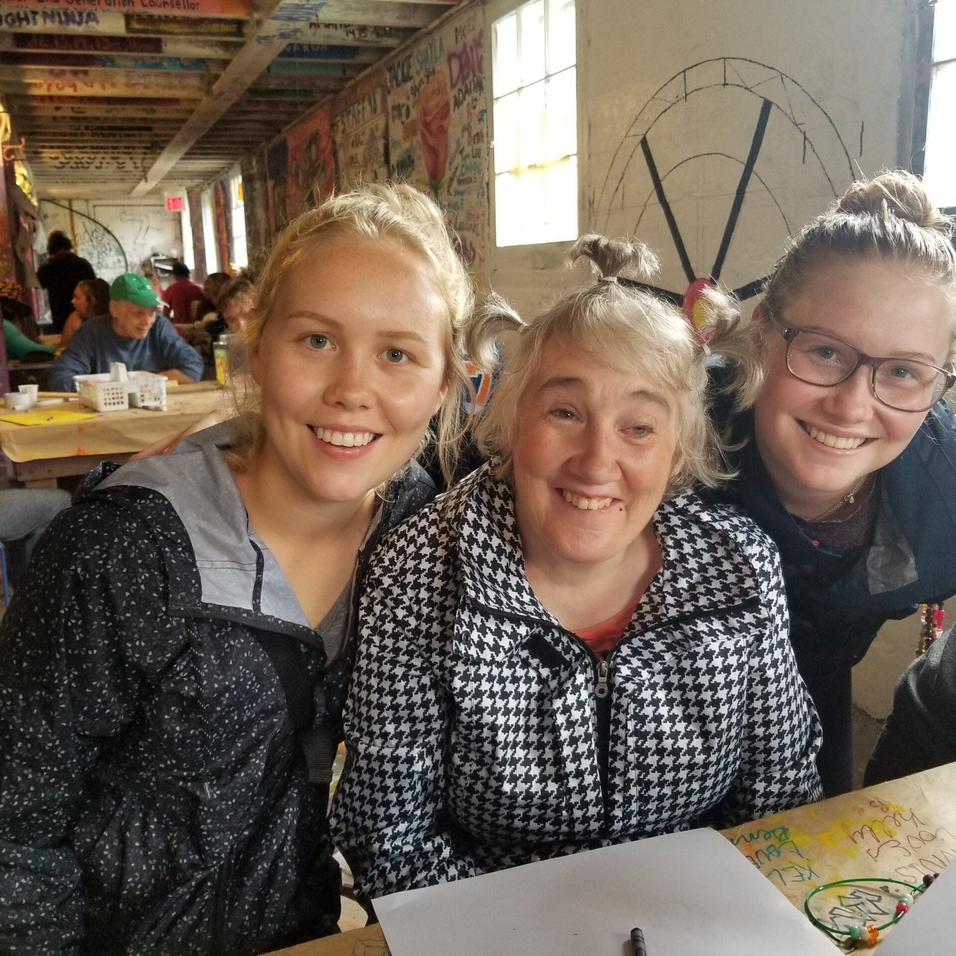 3 people inside at camps art barn