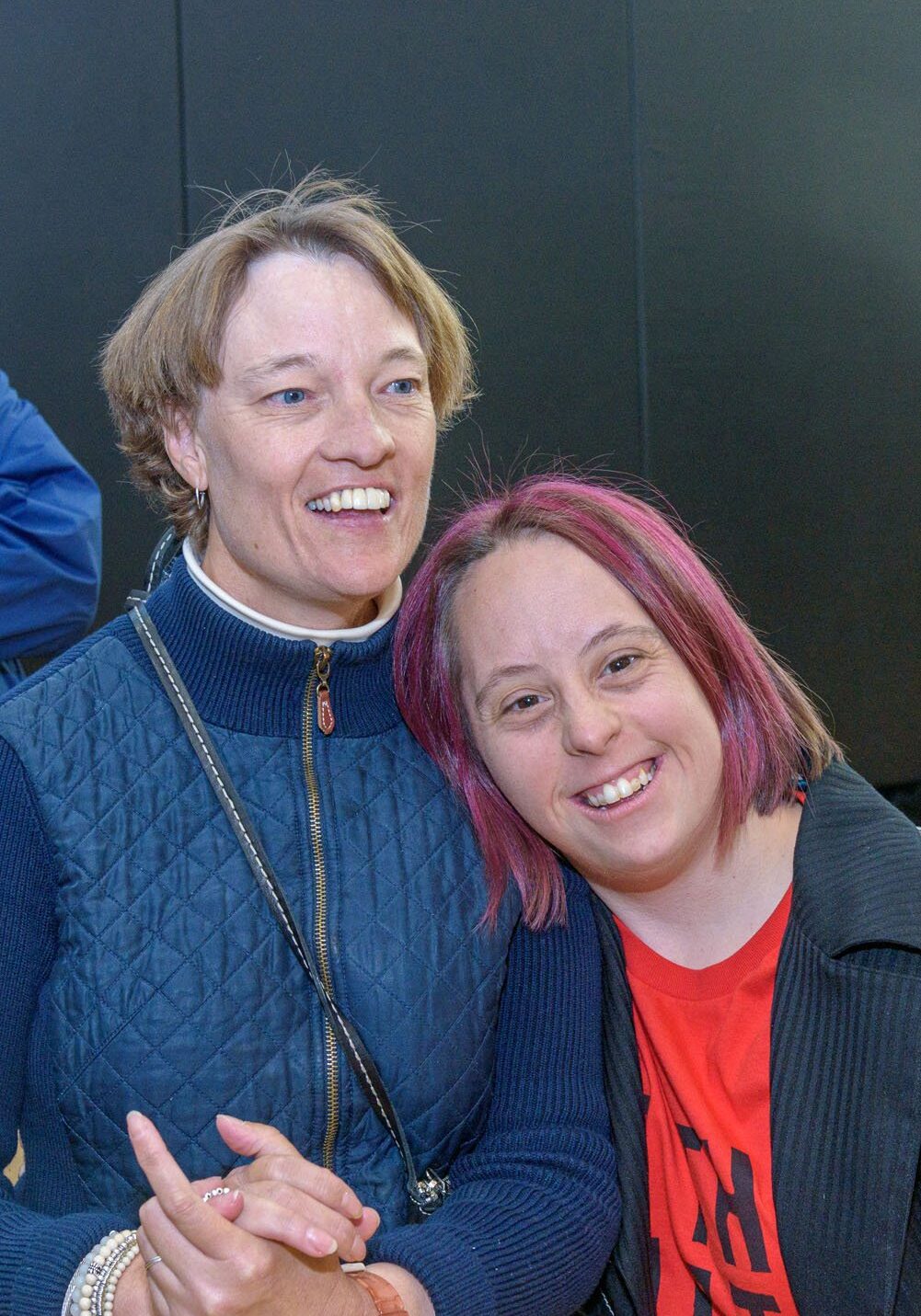 2 women posing together with smiles